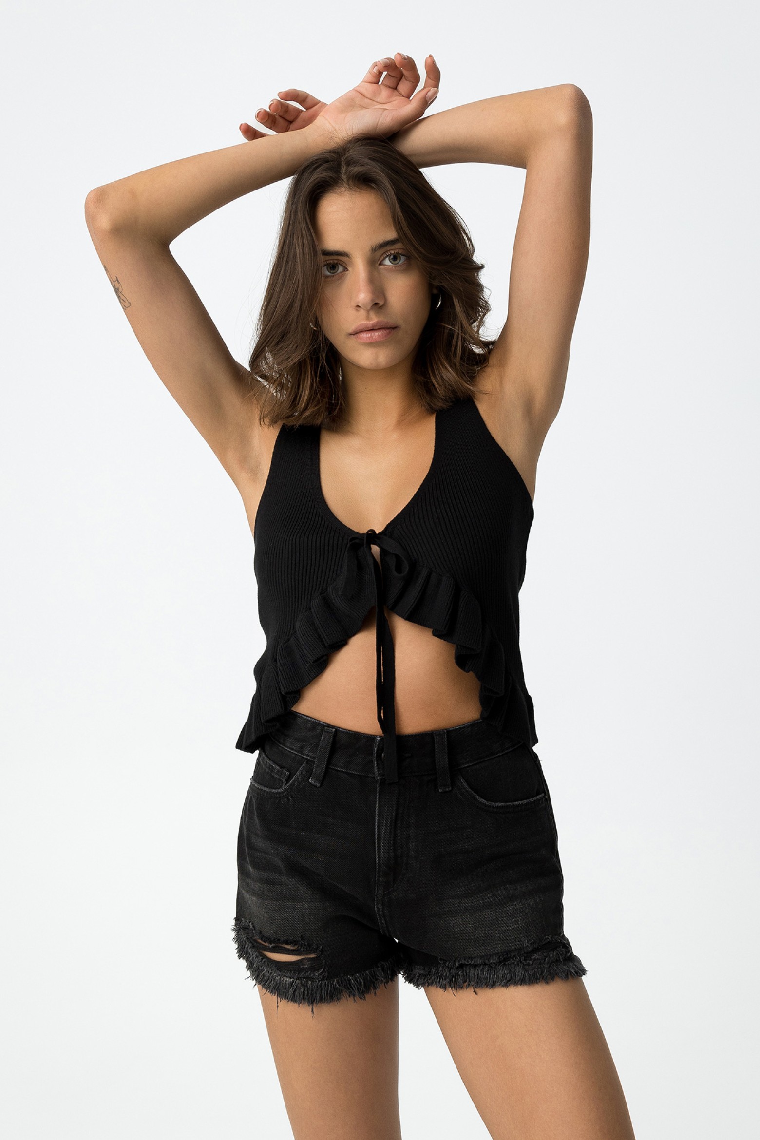 Top de malla efecto chaleco con volante