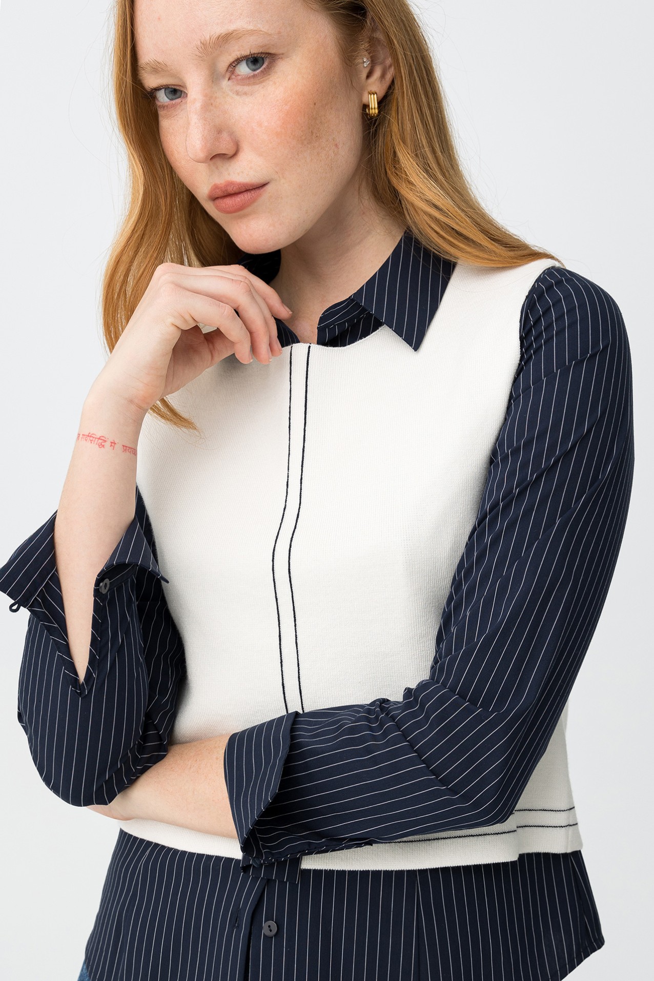 Off-white sleeveless knit top