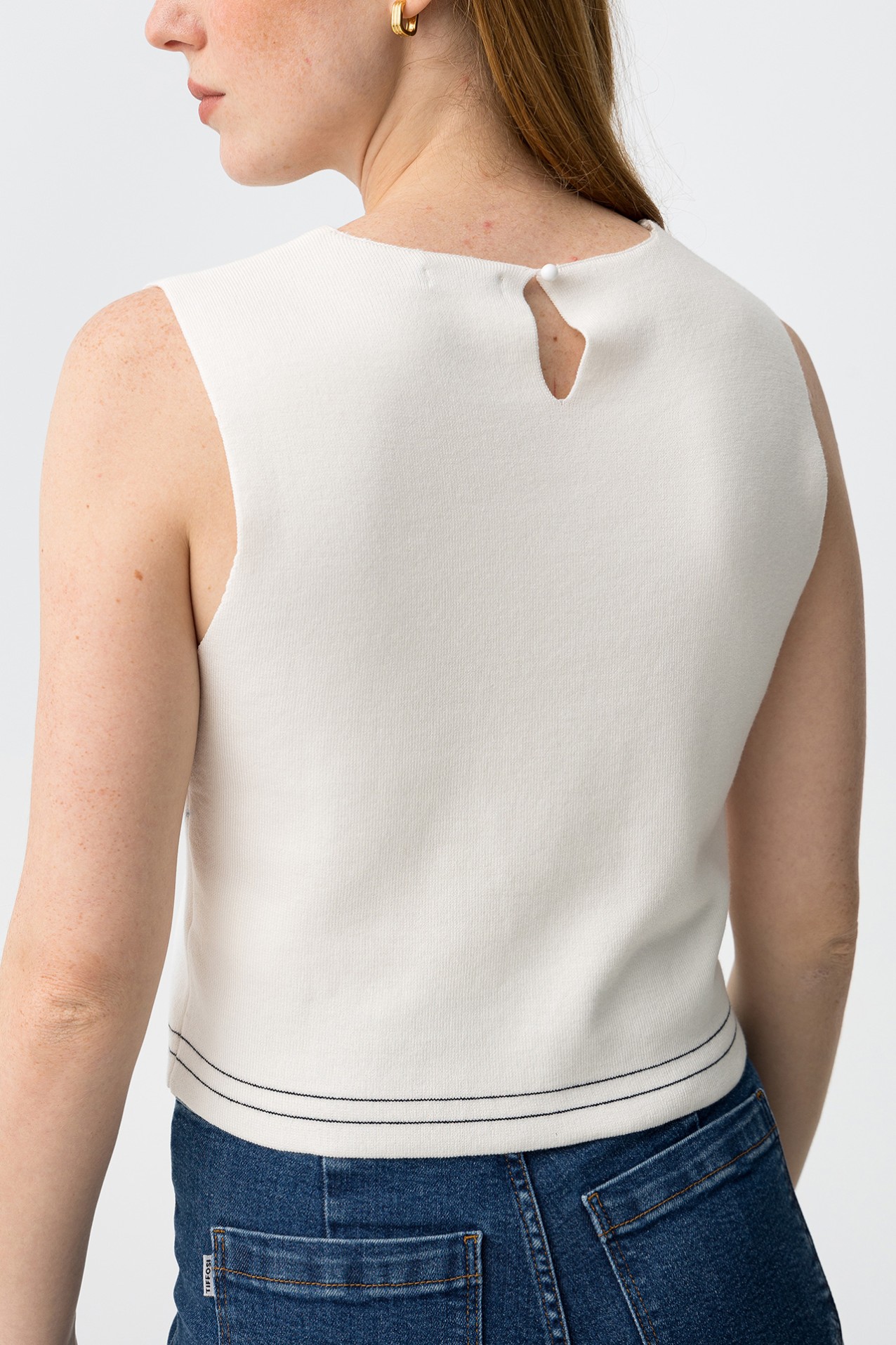 Off-white sleeveless knit top