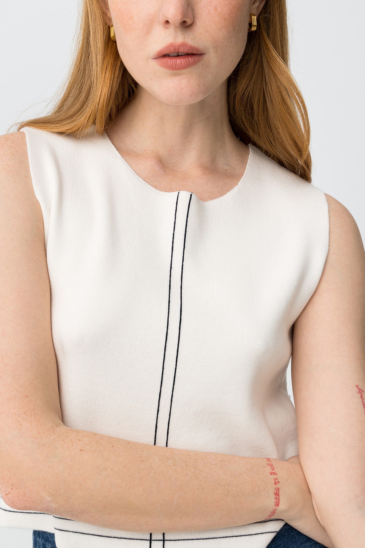 Off-white sleeveless knit top